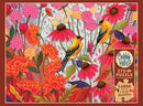 A colorful jigsaw puzzle titled 'Springtime Goldfinches' by Cobble Hill. The image features two vibrant goldfinches among a lush backdrop of blooming flowers in shades of orange, pink, and green. This 275-piece puzzle includes a poster for reference, highlighting the cheerful and artistic design perfect for nature lovers.