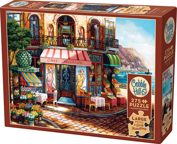 Cobble Hill jigsaw puzzle titled 'Chez Michelle'. This vibrant 275-piece puzzle features a charming street scene with a bistro, flowers, and outdoor seating, perfect for families and puzzle enthusiasts. Includes a poster for reference.