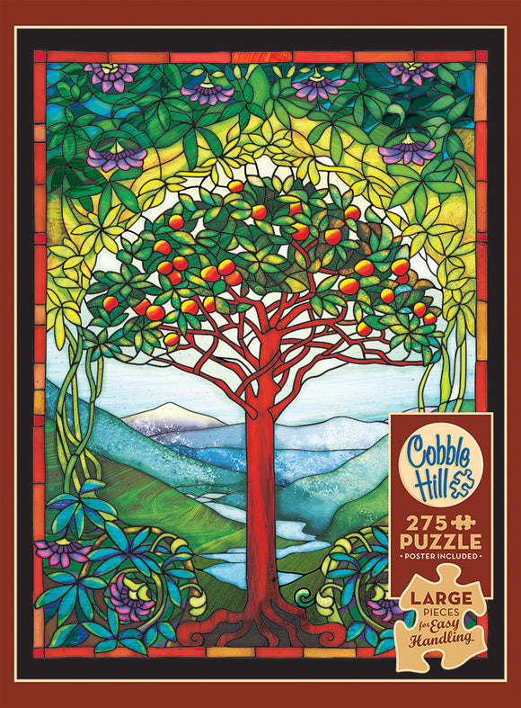 Tree of Life Stained Glass jigsaw puzzle by Cobble Hill featuring a vibrant stained glass design with a central tree filled with colorful fruits, surrounded by lush greenery and mountains in the background. The puzzle contains 275 large pieces for easy handling and includes a poster of the image.