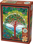 Cobble Hill Tree of Life Stained Glass jigsaw puzzle featuring colorful stained glass artwork of a vibrant tree surrounded by lush green foliage and mountains in the background. The puzzle includes 275 large pieces for easy handling and also comes with a poster for reference.