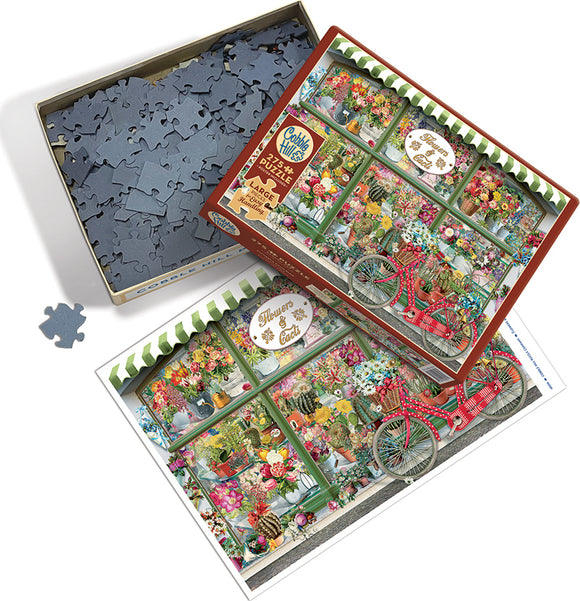 A jigsaw puzzle box titled 'Flowers and Cacti Shop' by Cobble Hill, featuring a vibrant image of a flower shop with various plants and a red bicycle. The puzzle pieces are scattered around the open box, showcasing their interlocking shapes.