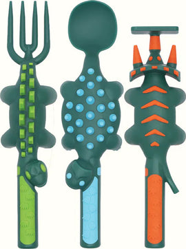 Colorful children's utensil set featuring dinosaur-themed designs. The set includes a fork shaped like a dinosaur tail, a spoon with a textured surface for grip, and a playful knife resembling a dinosaur head. Each utensil is bright green and orange, making mealtime fun for kids.