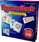 A box of Rummikub: 6 Player Edition game featuring colorful numbered tiles. The packaging prominently displays the game's title and indicates it accommodates 2-6 players, recommended for ages 8 and up.