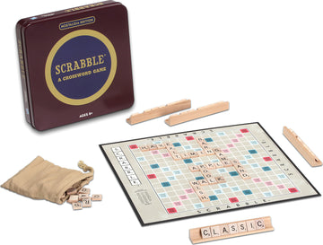 The Scrabble Nostalgia Tin from Winning Solutions showcases a classic crossword game. The vibrant tin features the Scrabble logo in gold against a deep red background. Surrounding the board is a collection of wooden letter tiles and tile racks, with a canvas bag containing additional letter tiles. The game board itself displays a colorful grid for arranging words, evoking a sense of nostalgia for family game nights.