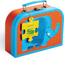 A colorful jigsaw puzzle box featuring a smiling blue elephant on an orange background. The puzzle is designed for children aged 3 and up, and includes a tag stating 'my first puzzles' by Crocodile Creek.