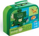 A colorful and engaging Barnyard Sounds 24-piece floor puzzle by Crocodile Creek, presented in a green carrying case. The front of the case features playful animal illustrations and the puzzle's name. Ideal for young children aged 3 and up, this jigsaw puzzle promotes learning through play by introducing barnyard animals and their sounds.