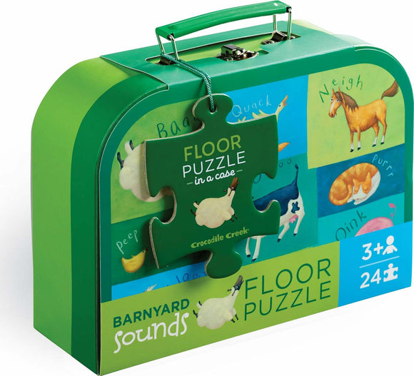 A colorful and engaging Barnyard Sounds 24-piece floor puzzle by Crocodile Creek, presented in a green carrying case. The front of the case features playful animal illustrations and the puzzle's name. Ideal for young children aged 3 and up, this jigsaw puzzle promotes learning through play by introducing barnyard animals and their sounds.