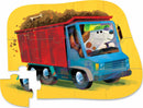 A colorful 12-piece jigsaw puzzle featuring a playful dog driving a blue truck loaded with dirt, set against a bright yellow background. The puzzle pieces are shaped, creating a fun and engaging play experience for children.