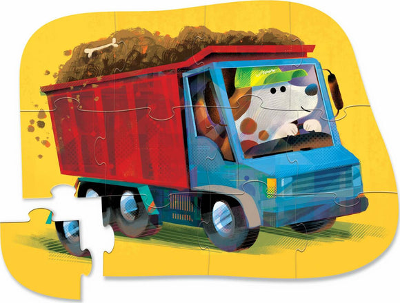A colorful 12-piece jigsaw puzzle featuring a playful dog driving a blue truck loaded with dirt, set against a bright yellow background. The puzzle pieces are shaped, creating a fun and engaging play experience for children.