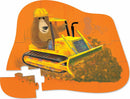 A vibrant and colorful jigsaw puzzle featuring a playful bear wearing a yellow hard hat, driving a bright yellow bulldozer. The puzzle showcases an orange background and displays several interlocking pieces, emphasizing the cheerful design.