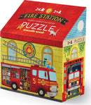 A colorful jigsaw puzzle box featuring a vibrant illustration of a fire station with a fire truck, ladder, and playful animals. The puzzle is designed for children aged 3 and up and includes 24 pieces.