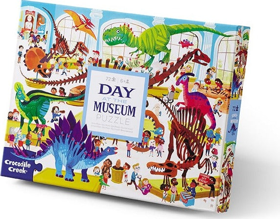 Day at the Dinosaur Museum jigsaw puzzle by Crocodile Creek featuring colorful illustrations of dinosaurs, children, and museum scenes, designed for ages 6 and up.
