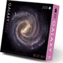 Galaxy Puzzle Milky Way by Crocodile Creek, featuring a stunning image of the Milky Way galaxy. This 200-piece jigsaw puzzle showcases detailed photography sourced from NASA archives, perfect for space enthusiasts and puzzle lovers.