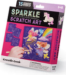Sparkle Scratch Art Magical Friends by Crocodile Creek. The packaging features colorful illustrations of unicorns and fairies, along with scratch sheets and wooden styluses. Suitable for ages 5 and up, it encourages creativity and imaginative play.