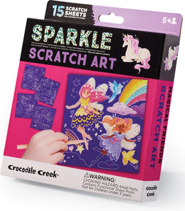 Sparkle Scratch Art Magical Friends by Crocodile Creek. The packaging features colorful illustrations of unicorns and fairies, along with scratch sheets and wooden styluses. Suitable for ages 5 and up, it encourages creativity and imaginative play.