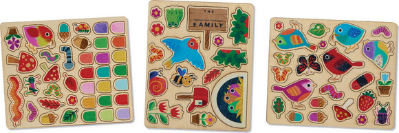 A colorful DIY kit titled 'Design a Bird House' by Crocodile Creek. The kit includes various wooden pieces featuring vibrant illustrations of birds, flowers, leaves, and other nature-themed elements for creative assembly.