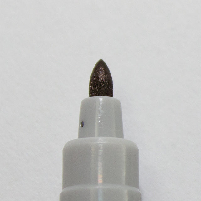 Close-up view of a Water Soluble Marker from Chessex, featuring a pointed tip. The marker is designed for use in games, allowing vibrant colors to dissolve in water, enhancing creative expression in game play.