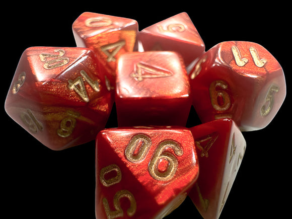 A set of Mini Scarab RPG dice in a vibrant scarlet color with shimmering gold numbers. The dice include various shapes typical for role-playing games, showcasing their intricate design and glossy finish.