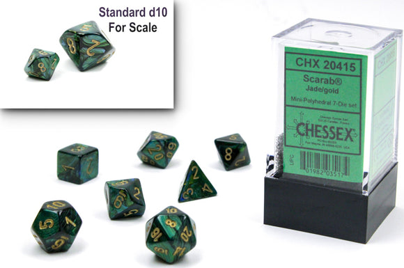 Chessex Scarab Mini polyhedral dice set in jade and gold. The set includes seven dice arranged artfully, with a standard d10 visible for scale. The packaging is clear, showing the brand and product details.