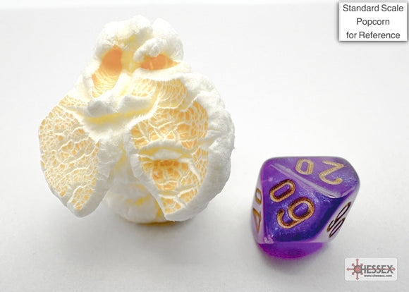 Chessex Mini Borealis Purple/Gold 7-sided die displayed next to a piece of popcorn for scale. The die features a vibrant purple color with gold numbering, ideal for tabletop gaming.