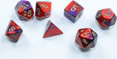 A set of seven Mini Gemini RPG dice featuring a vibrant purple-red color with gold numbering. The dice include various shapes such as d4, d6, d8, d10, d12, and d20, perfect for tabletop gaming.