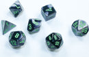 A set of Mini Gemini RPG dice in black and grey with green numbers, featuring a d4, d6, d8, d10, d12, and d20, ideal for tabletop gaming.