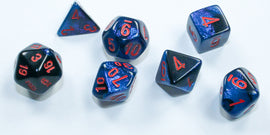 A set of Mini Gemini RPG dice in Black-Starlight color by Chessex. The seven polyhedral dice feature a glossy black base with shimmering blue accents and bold red numbering. They include shapes like a d20, d12, d10, d8, d6, d4, and d% for tabletop gaming.