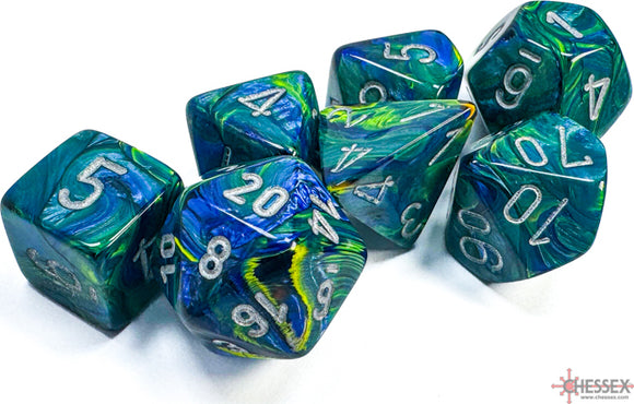 Set of six polyhedral dice in a mix of green and blue colors with silver numbers. The dice include various shapes such as d4, d6, d8, d10, d12, and d20, showcasing a colorful swirl pattern.