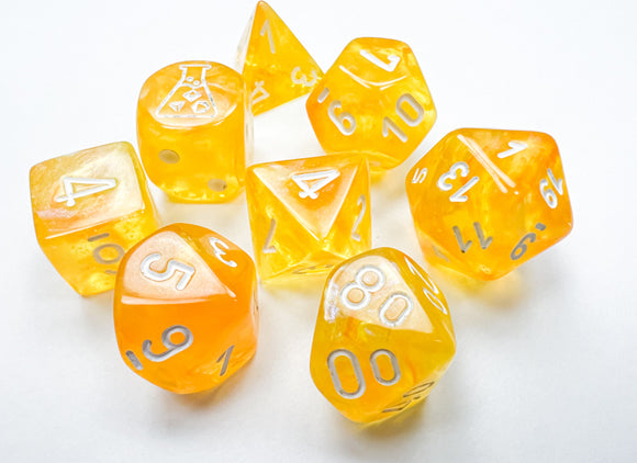A vibrant polyhedral dice set consisting of eight luminous dice in Borealis Canary and white. The dice display a range of numbers and symbols, showcasing their unique translucent yellow and white design, making them perfect for tabletop games.