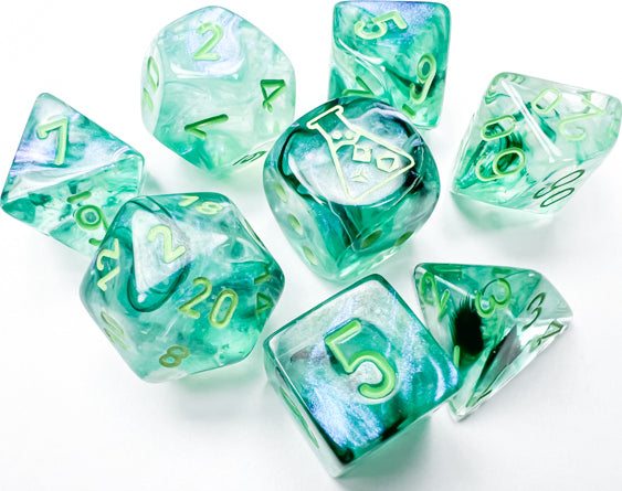 A 7-piece luminary dice set in Borealis Kelp and light green colors. The set includes various polyhedral shapes like d4, d6, d8, d10, d12, and d20. Each die features gold numbering and a unique translucent design that sparkles under light. Perfect for tabletop games and role-playing adventures.