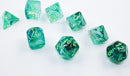 A set of seven luminary dice in Borealis Kelp and light green colors. The dice feature intricate swirls of green and translucent effects, with golden numbers and a beaker symbol on one die, designed for tabletop games.