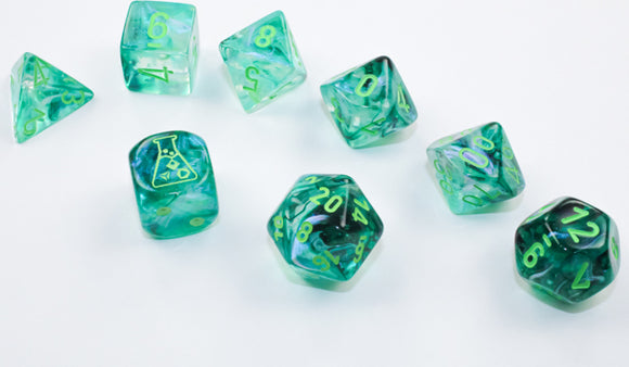 A set of seven luminary dice in Borealis Kelp and light green colors. The dice feature intricate swirls of green and translucent effects, with golden numbers and a beaker symbol on one die, designed for tabletop games.