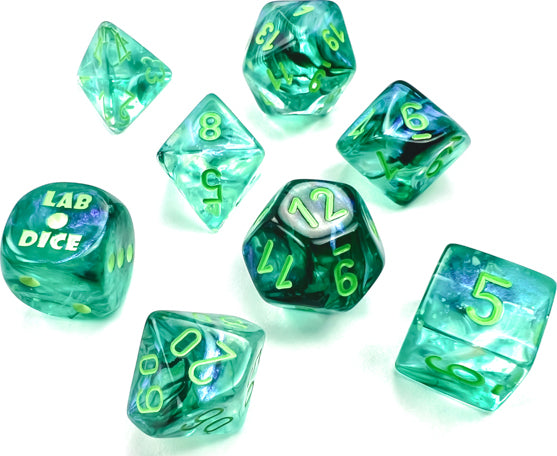 A vibrant 7-piece dice set in Borealis Kelp and light green colors by Chessex. The set includes various polyhedral dice with clear resin and luminous numbers, perfect for tabletop gaming.