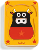 Leo & Co 4 Layer Puzzle by DJECO featuring a colorful design of a cow on a bright yellow background with stars. Perfect for toddlers to enhance their motor skills and cognitive development through play.