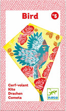 A vibrant DJECO Bird Kite featuring a beautifully illustrated bird design in shades of blue and pink, surrounded by colorful roses and detailed patterns. Perfect for outdoor play, the kite is ideal for children aged 5 and up, promising fun in the sky.