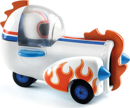 The Crazy Motors: Astro Rocket is a whimsical toy vehicle designed by DJECO, featuring a colorful white body with vibrant flame details, rounded shapes, and a transparent cockpit. It has a fun design that appeals to children, combining elements of racing and imaginative play.
