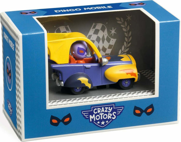 The Crazy Motors: Dingo Mobile toy features a colorful design with purple and yellow accents. The miniature car is nestled within a transparent display box adorned with the Crazy Motors logo and playful mask graphics. A small character, dressed in a mask, is seated in the driver's position, ready for imaginative adventures. The background includes a checkered pattern, evoking a racing theme.