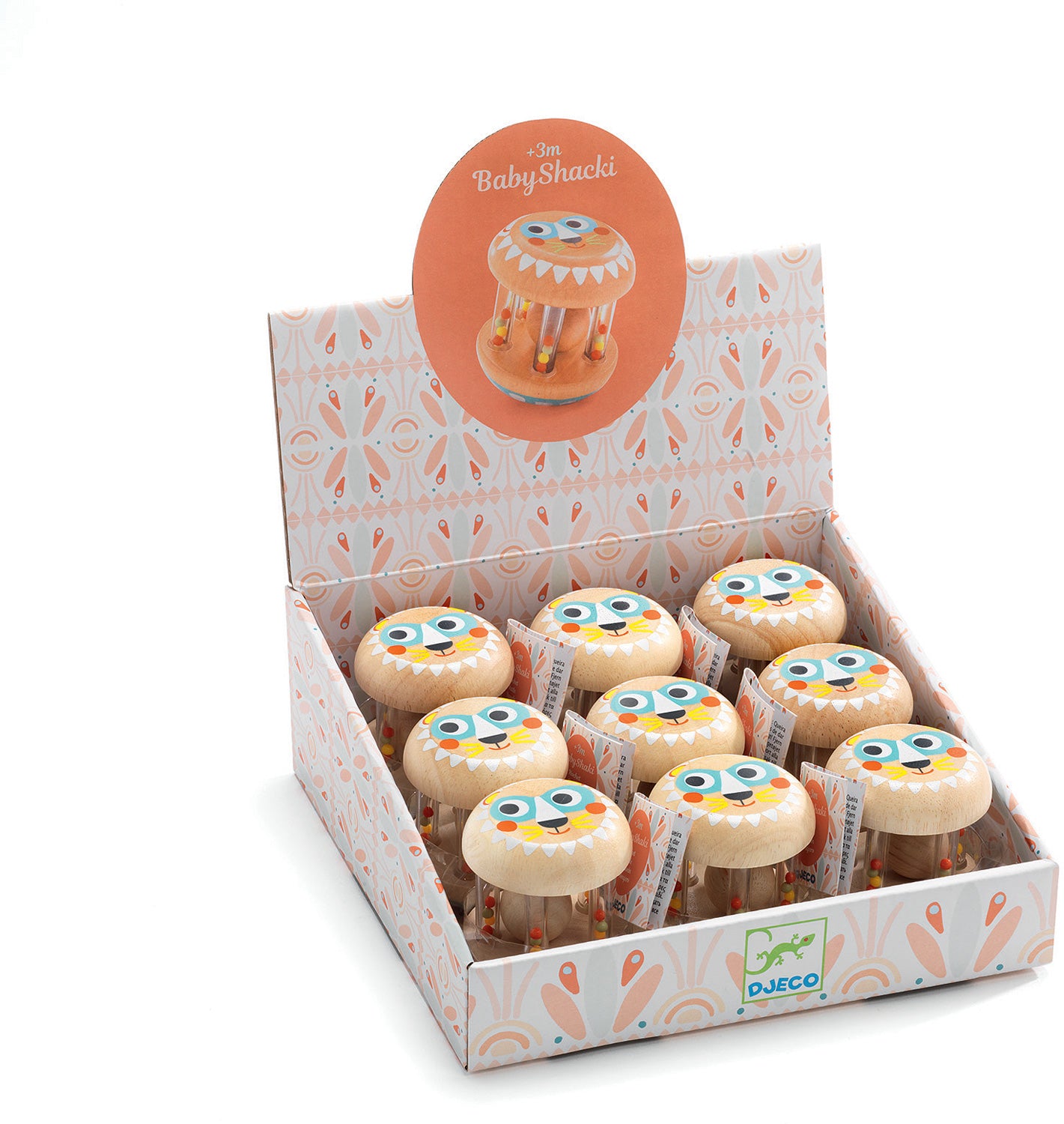 A colorful display of the BabyShaki toy by DJECO. The packaging showcases multiple wooden shakers shaped like friendly creatures, each featuring bright eyes and smiles. The vibrant box is adorned with playful patterns, suitable for children aged 3 and up, emphasizing fun and sensory play.