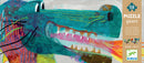 A colorful jigsaw puzzle featuring 'Leon the Dragon' by DJECO. The artwork showcases a whimsical dragon with vibrant shades of blue, green, and red, surrounded by playful patterns and textures.