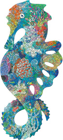 A vibrant jigsaw puzzle shaped like a seahorse, featuring intricate underwater designs in a variety of colors including blue, green, orange, and pink. The puzzle illustrates coral reefs and marine life, providing an engaging and colorful experience for puzzle enthusiasts.