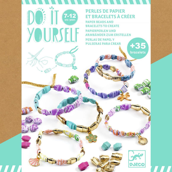 A colorful DIY kit for creating paper beads and bracelets by DJECO. The kit showcases multiple finished bracelets made from vibrant paper beads and metallic accents, surrounded by additional beads ready for crafting. Suitable for children aged 7-12 years.