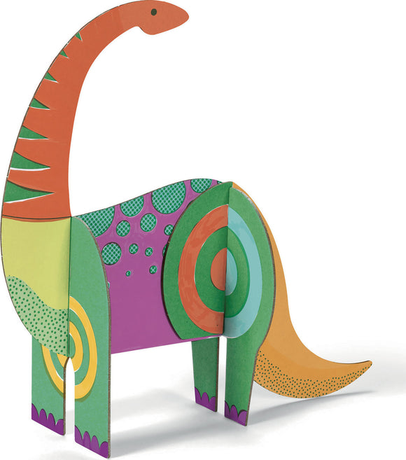 A colorful dinosaur figure made from cardboard, featuring vibrant patterns and shapes. The dinosaur stands upright, showcasing its bright green, orange, and purple colors with playful polka dots and swirls, designed for assembling and imaginative play.