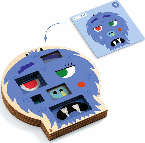 The Crazy Faces Sologic by DJECO is a blue, round mechanical puzzle featuring whimsical facial features. The puzzle includes cut-out sections that reveal different colorful images, encouraging interactive play. The product is designed for children, promoting creativity and problem-solving skills.