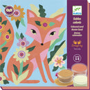 DJeco Garden Lights Colored Sands art kit featuring a vibrant illustration of a fox surrounded by colorful flowers. The package includes three jars of colored sand for creative crafting. Designed for ages 5-8.
