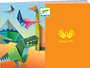 Dinosaur Origami DIY Kit by DJECO featuring vibrant illustrations of paper dinosaurs, including a T-Rex and other colorful designs. The kit includes detailed instructions and colorful origami sheets perfect for children to create their own paper dinosaurs.