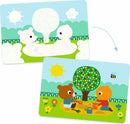 A whimsical illustration of two cute animal characters, a bear and a bird, playing in a sunny park scene. One is digging in the sand with colorful buckets while the other sits nearby, surrounded by flowers and a tree. This fun and engaging paint with water activity by DJECO features vibrant colors and playful designs that inspire creativity in children.