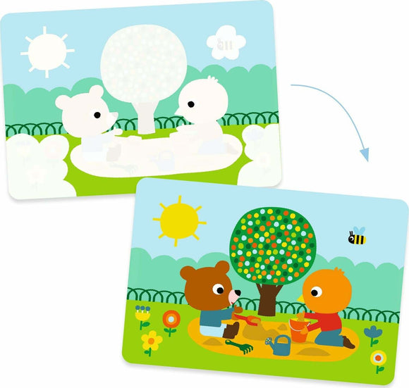 A whimsical illustration of two cute animal characters, a bear and a bird, playing in a sunny park scene. One is digging in the sand with colorful buckets while the other sits nearby, surrounded by flowers and a tree. This fun and engaging paint with water activity by DJECO features vibrant colors and playful designs that inspire creativity in children.