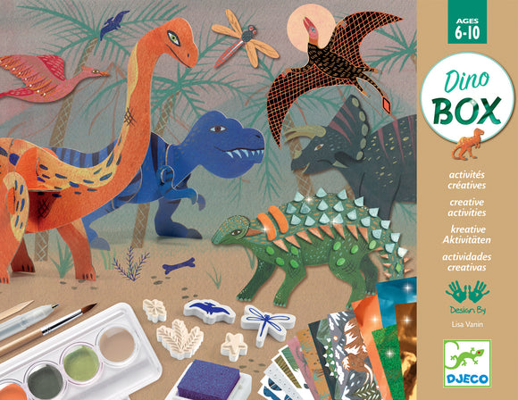 The World of Dinosaurs DIY kit by DJECO featuring colorful dinosaur and nature illustrations. Includes various art supplies like paints, brushes, and decorative elements for creative activities. Suitable for children aged 6 to 10.