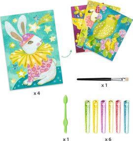 Djeco Carnival of Animals Glitter DIY kit includes four illustrated cards featuring vibrant animal designs, a brush, a tool for glitter application, and six glitter tubes in various colors, perfect for creative crafting.
