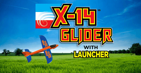 The X-14 Glider with Hand Launcher features a bright orange and blue design against a clear blue sky with green fields in the background. The image showcases the glider product logo, emphasizing fun and outdoor play.